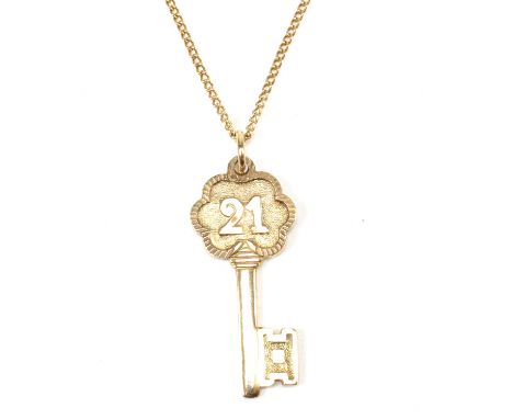 A hallmarked 9ct gold Georg Jensen key pendant necklace. The hallmarked 9ct gold pendant in the form of a key with the number