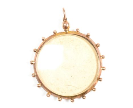 A hallmarked 9ct gold photo window locket pendant. The hallmarked 9ct gold locket having two windows in a 9ct gold locket wit