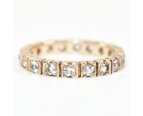 A 9ct rose gold and diamond eternity ring. The ring set all around with round cut diamonds.&nbsp;Marked 9ct. Size N.5. Weighs