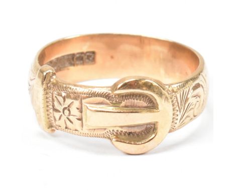 A hallmarked 9ct gold buckle ring. The buckle ring having scrolling bright cut engraved decoration to plain shank. Hallmarked
