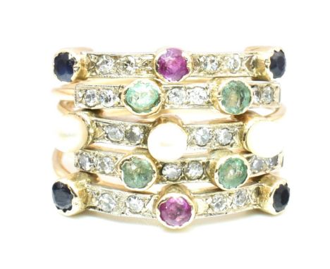 A five stack gem set harem ring having bezel set pearls, emeralds, rubies and sapphires with single cut diamonds united by ba