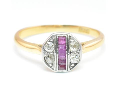 A 1920s 18ct gold, ruby and diamond target ring. The antique ring having an octagonal shaped head set with four illusion set 