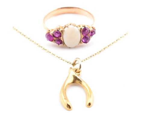 A gold, opal and ruby ring together with a hallmarked 9ct gold pendant necklace AF. The lot to include a gold ring set with a
