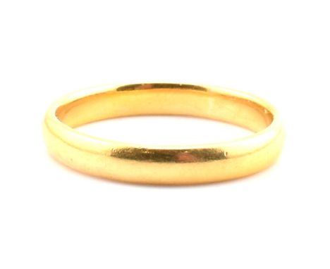 A George V hallmarked 22ct gold band ring. The 22ct gold band ring hallmarked for Birmingham, 1925. Maker's mark A&amp;W. Siz