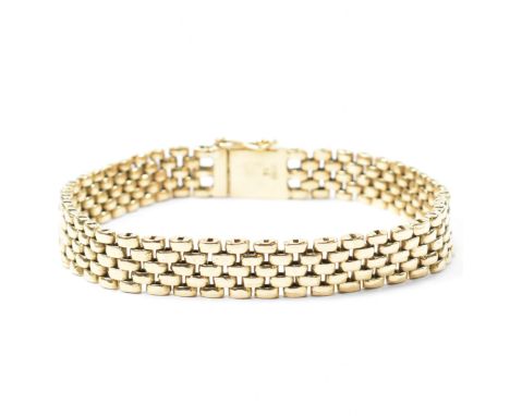 A 14ct gold gate link bracelet. The 14ct yellow gold bracelet having a gate link design to box clasp with fold-down safety cl