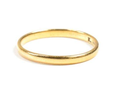 A hallmarked 22ct gold band ring. The 22ct yellow gold band ring hallmarked for Birmingham, 1949. Size N.5. Weighs 1.8g. All 
