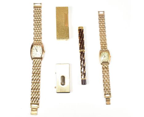 A collection of gold tone metal accessories including a Dunhill pocket lighter. The gentleman's accessories to include a Dunh