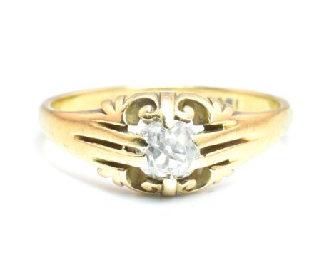 An 18ct gold and diamond signet ring. The 18ct gold ring having a single old cut diamond set in a scrolling mount to tapered 