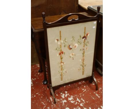 A Georgian style mahogany drop leaf table on pad feet 110cm extended and an Edwardian mahogany framed fire screen