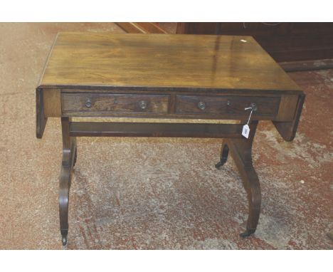 A Regency rosewood sofa table , circa 1820, in the manner of Gillows of Lancaster, with two short frieze drawers and opposing