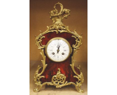 A continental mantel clock, 38cm high and a wall bracket (2)