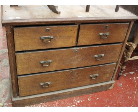An early 20th Century oak chest with two short and two long drawers 108cm wide and a domed trunk 