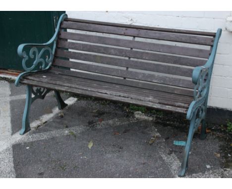 A garden bench with painted supports 