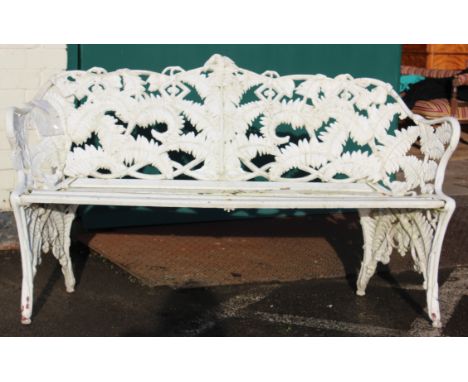 A painted aluminium garden bench in Coalbrookdale style and a table and two chairs 