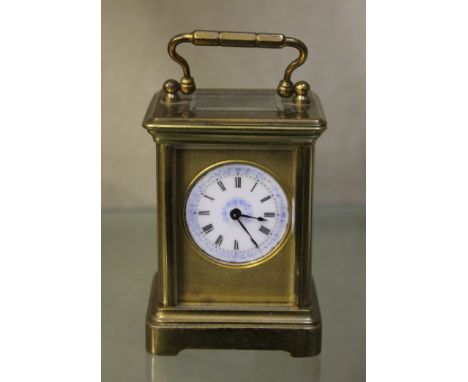 A carriage timepiece, with Roman numeral enamel dial, 11cm high (including handle) 