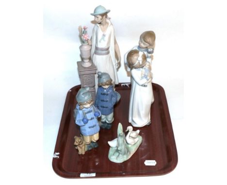 Two Nao figures of children in nightgowns; a Lladro figure of a lady in 1920's dress; a Nao model of geese; and two Nao model