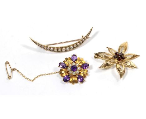 An amethyst and cultured pearl brooch, stamped '9' '.375'; a garnet brooch, stamped '9' '.375'; and a split pearl crescent br
