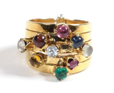 A multi-gemstone stacking ring, of five bands each set with a cabochon, including emerald, citrine, paste, moonstone, ruby an