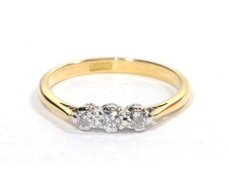A diamond three stone ring, the round brilliant cut diamonds in white claw settings, total estimated diamond weight 0.30 cara
