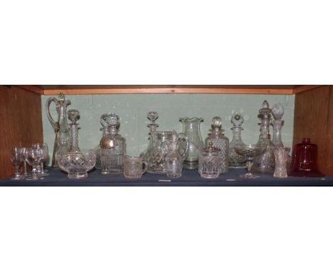 A quantity of decorative ceramics and glass including a whisky decanter with silver gin label, various decanters and stoppers