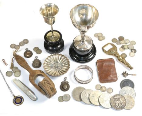 A silver trophy cup; a quantity of coins; a silver pin dish; silver medals; silver napkin ring; silver and mother of pearl pe