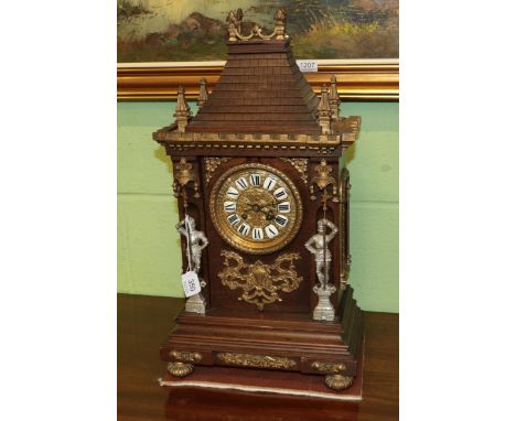 A gilt metal mounted striking mantle clock of architectural form, with knights in armour pilasters, retailed by Ferguson &amp