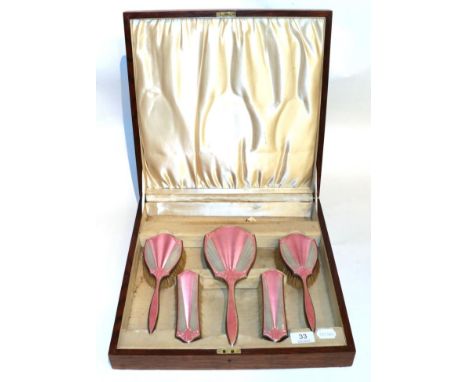 A silver and pink guilloche enamel dressing table set in an oak case 