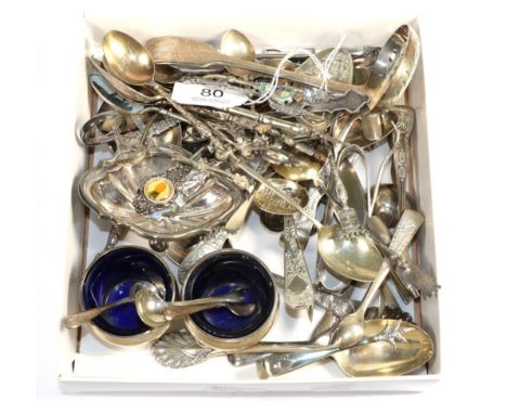 A quantity of assorted silver including sugar tongs and nips; salts and assorted plated and enamel spoons 