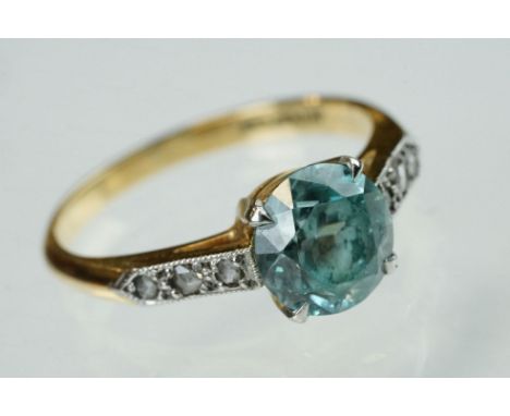 Topaz and diamond 18ct yellow gold and platinum set ring, the round mixed cut blue topaz diameter approx 7.5mm, claw set, thr