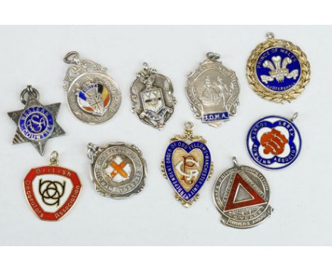 Ten Silver hallmarked watch fobs, early to mid 20th century, with enamel decoration, featuring sporting related examples 