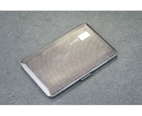 Silver cigarette case, rectangular form, engine turned decoration, rectangular blank cartouche with stepped decoration, gilt 