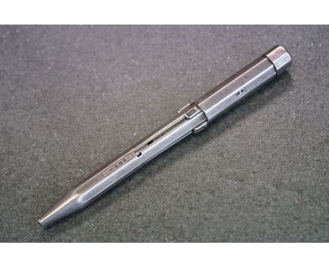 Silver pencil with 4 retractable nibs and engine turned decoration, by JM &amp; Co, London 1938, approx 13cm long 