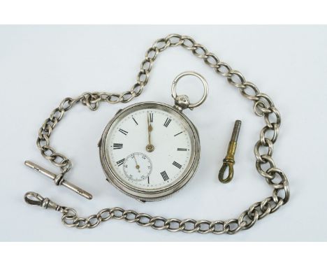 Late Victorian silver open faced key wind pocket watch, Chester 1900, with white enamel dial and seconds dial, gilt poker han