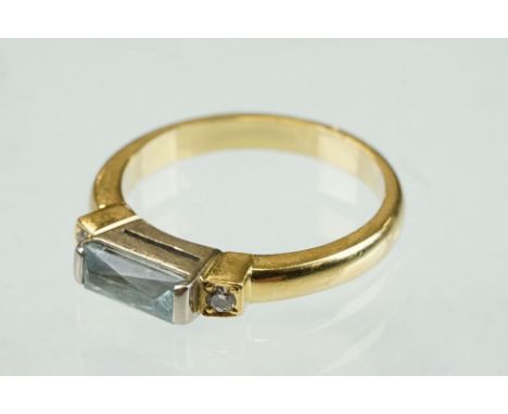 Aquamarine and diamond 18ct yellow gold ring, the rectangular mixed cut aquamarine measuring approx 3mm x 7mm, small round br