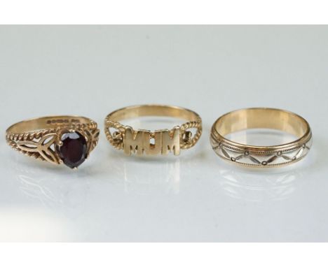 Three 9ct yellow gold dress rings; to include 'mum' 9ct gold ring, size T; 9ct yellow and white gold band, width approx 5mm, 