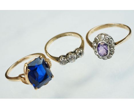 Blue stone 9ct yellow gold dress ring, possibly synthetic blue spinel, size M½; together with two paste set 9ct gold and silv