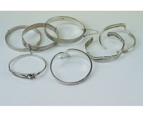 Blue topaz silver bangle, Rennie Mackintosh style; three silver hinged bangles together with a further three bangles (7) 