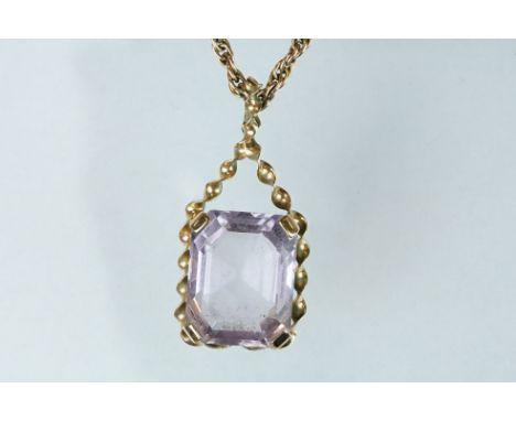 Amethyst 9ct yellow gold pendant necklace, rectangular cut amethyst, measuring approx 17mm x 13mm, claw set, rope twist surro