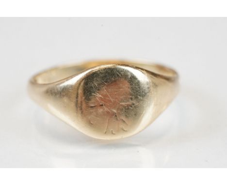 9ct yellow gold signet ring, rubbed engraving to the head, dimensions of head approx 11mm x 10.5mm, ring size X½ 