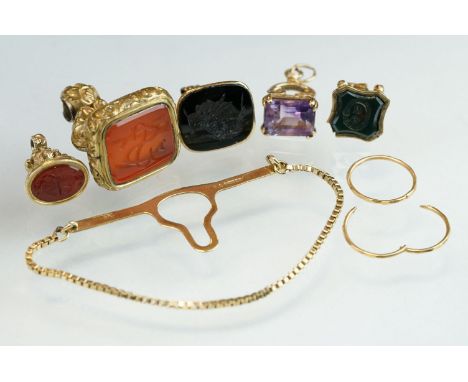 Amethyst 9ct yellow gold fob, four yellow metal and gold plated charms, and a 9ct yellow item 