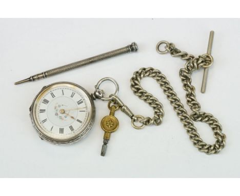 Silver open face key wind fob watch with enamel dial, Roman numerals and an engraved case with blank cartouche (diameter appr