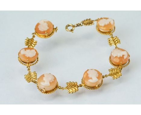 Shell cameo 9ct yellow gold bracelet, six round cameo panels each depicting a female head, claw settings, rope twist surround