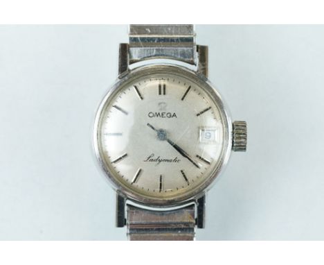 Omega ladymatic ladies stainless steel wristwatch, round champagne dial, black enamel baton numerals, black pencil hands, rep
