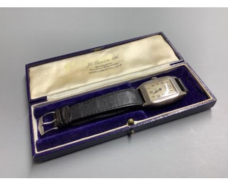   A gentleman's 1930's silver J.W. Benson manual wind wrist watch, on a leather strap.