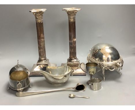   A pair of silver-plated Corinthian column candlesticks, height 28cm a small roll-top breakfast dish, a spoon warmer and fiv
