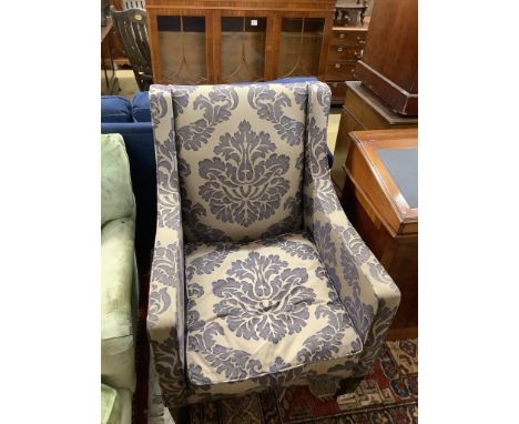 A contemporary armchair with silver/ blue patterned fabric, width 74cm, depth 76cm, height 100cm (Bought from the George Smit