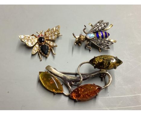   Two diamond and gemstone-set yellow metal insect brooches, largest 25mm, gross 7.8 grams and a silver and amber foliate ope