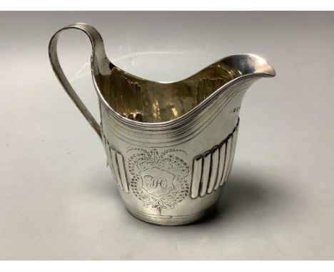   A George III part fluted silver oval cream jug, maker's mark rubbed, London, 1798, height 12.5cm, 4.5oz.