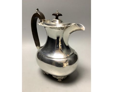   A London shape silver hot water pot with ebonised handle and finial,London 1909, Edward Barnard &amp; Sonsapprox gross 12.6