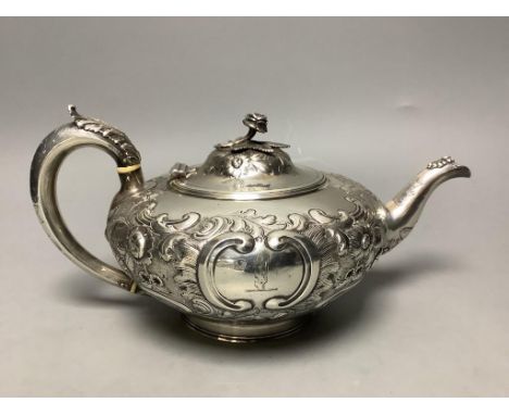   A Victorian embossed silver squat melon shaped teapot, Walter Morrise, London, 1846, height 14.1cm,gross 23oz.